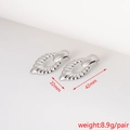 Detailed view of silver textured earrings with size measurements 42mm and 22mm - Textured Oval Hoop (17#)