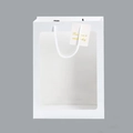 Close-up of white gift paper bag with transparent window, rope handles and small tag - Medium Window Handbag 25*15*35 / White