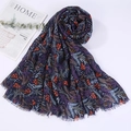 Detail of navy cotton linen scarf with colorful leaf prints and elegant fringe edges - Style 27