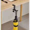 Portable black metal desk hook with adjustable C-clamp holding a yellow umbrella - Foldable Type / Black