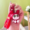 Simpatico portachiavi con coniglio portafortuna rosso e bianco con cinturino in silicone - Stile Donna Ricca