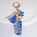 Royal blue resin keychain with butterfly charm and gold tassel for women handbags - Letter I