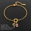 Elegant 14K gold plated stainless steel bracelet with heart and pink stone charm pendants - Letter P
