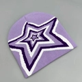 Detailed close-up of light purple knitted beanie with a layered star embroidery pattern - One Size / Purple