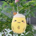Detailed view of yellow plush bubble tea keychain with pineapple embroidery and straw - 11cm / Yellow Squint