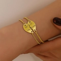 Golden alloy heart friendship bracelets with engraved Best Friends charms on wrist - Antique Gold Heart Bracelet Style (A-450)