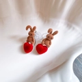 Close-up of brown suede bunny earrings with red flocked heart charms on shell tray - Brown Bunny Flocked Heart Style (57#)
