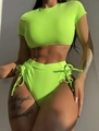 Dettaglio del bikini verde neon a vita alta con coulisse laterali e tessuto a coste - S / Verde