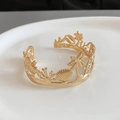 Macro detail of golden starfish open bracelet with embossed sea life and palm tree patterns - Ocean Ecology Relief (3#)