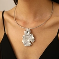 Macro shot of silver vintage flower petal pendant on a sleek choker collar necklace - Silver Flower Choker (11440)