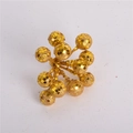 Close-up of sparkling gold glitter berry stems for Christmas tree and wreath DIY decor - Short Gold Glitter Berry