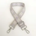 Detail of 3.8cm wide woven geometric strap with silver metal hooks and buckle - Beige Purple Silver Hook