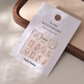 Detailed close-up of 5D pearl nail art stickers with silver accents on display card - MJ-037 Silver Foil Style