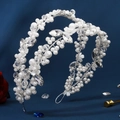 Detail of baroque bridal headband with white pearls and crystal flowers on blue backdrop - Silver With White Pearl