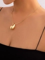 Polished gold teardrop pendant necklace on thin chain worn by a female model - Vertical Water Drop Necklace (F203) / Gold