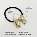 Detail showing the dimensions of the golden metal bowknot on a black hairband - Squared Gold