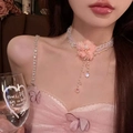 Close-up of a pink fabric flower choker featuring delicate beads and long tassel pendants - 3# White Pink Flower