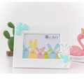 White resin photo frame with blue balloon decor and 3D rabbit detail for kids' room - Blue Rabbit Horizontal / 7"