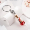 Portachiavi bottiglia in vetro con paillettes rosse e ciondolo a forma di conchiglia - Rosso