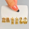 Close-up of gold alloy earring set featuring leaf design and brushed metal textures - 16 KC Gold (9013)