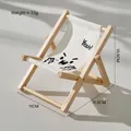 Mini wooden folding chair phone stand with white canvas and cute cartoon print - Emoji Yeah!