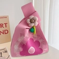 Pink knitted tote bag with flower pattern and 3D floral pendant in a minimalist setting - Pink Sun Flower (Without Accessory)