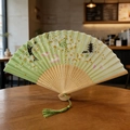 Classic folding fan in light green fabric with cherry blossom and rabbit patterns - Style 43 (New Style)