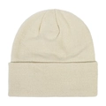 Close-up detail of a beige knitted winter beanie hat showing fine ribbing texture - Beige