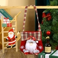 Detailed view of red felt Christmas gift bag featuring 3D Santa and plaid handles - New Handbag Santa