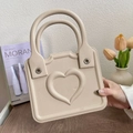 Beige EVA handbag featuring a minimalist 3D embossed heart design and sturdy handles - Khaki