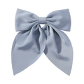 Detail shot of a large grey satin bow hair clip with smooth texture on white background - Blue