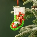 Festive green Christmas stocking ornament with red bow on a snowy pine branch - Flower Stocking Cover 8*12CM