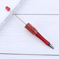 Elegant red DIY beadable pen with crystal rhinestone decoration on a wooden background - Red