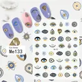 Macro shot of evil eye nail art stickers Me133 with blue star patterns on manicured nails - Me133