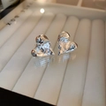 Macro shot of silver heart studs with unique lava texture on a white display box - Real Gold Plated Silver-Color Wrinkled Heart Silver Earring Post Earrings