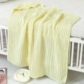 Detailed texture of 6-layer cotton muslin gauze hooded baby towel in soft yellow - Yellow