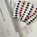 Detail of pleated chiffon fabric with colorful geometric triangle pattern on white base - Shrapnel Bag/Small / Off-White Geometric Shrapnel Bag
