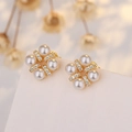 Elegant gold flower earrings with white pearls and sparkling zircons on a soft floral backdrop - Flower Pearl Stud Earrings / 14K Gold