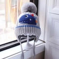Grey knit kids dinosaur beanie with yellow accents and a large faux fur pom-pom - Dinosaur Ear Flap Space Gray