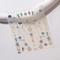 Stickers à ongles bohèmes bleu et or avec motifs floraux sur feuille transparente M-611 - Totem de Motif M-611