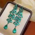 Detailed view of vintage bow pearl drop earrings in a luxury leather jewelry case - 46# Green Zirconia Leaf Waterdrop Pendant Studs