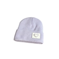 Close-up of a purple knitted beanie featuring a heart embroidery patch on the folded brim - One Size / Purple