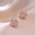 Elegante Ohrstecker aus Roségold in Blumenform mit Zirkonia auf Champagner-Seide - Herz Rotierende Ohrringe (E0128)