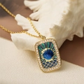 Gold tarot style pendant necklace with blue enamel shell and crystals on white coral - Shell