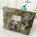 Green corduroy floral cosmetic bag with 'TIME TO PARTY' label and zipper closure - Large / Green Ditsy Floral