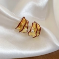Detail of gold wavy earrings with red trim and pearls on white silk background - Wavy Edge Pearl Style (Gold-White-Red)