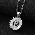 Macro detail of silver letter P pendant with cubic zirconia in a sunflower design - Silver Letter P