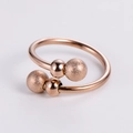 Detail of rose gold open ring with contrasting polished and frosted ball elements - Rose Gold