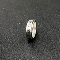 Silver spinner ring featuring butterfly engravings and a rotatable band in stainless steel - Etched Butterfly