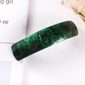 Detail view of a long dark green marble acetate hair clip with a smooth glossy finish - 16# Spring Clip (Dark Green Marble)